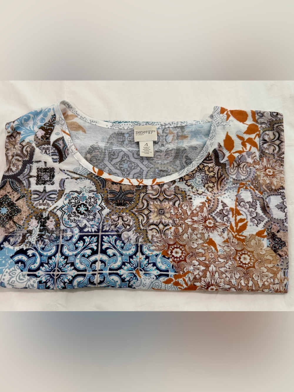 Chico’s Zenergy top. Mixed Print Scoop Neck - Blue, Brown, Rust, sequins.
